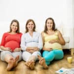 graphicstock-three-pregnant-women-sitting-in-front-of-